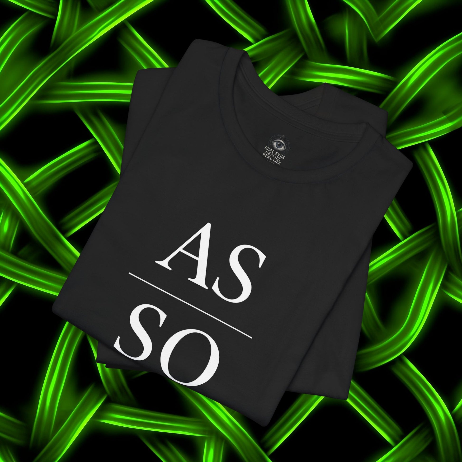 Folded black As Above So Below IYKYK t-shirt on glowing green abstract background.