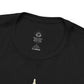 Close-up of black Nature Is Not Alternative t-shirt collar and fabric detail.