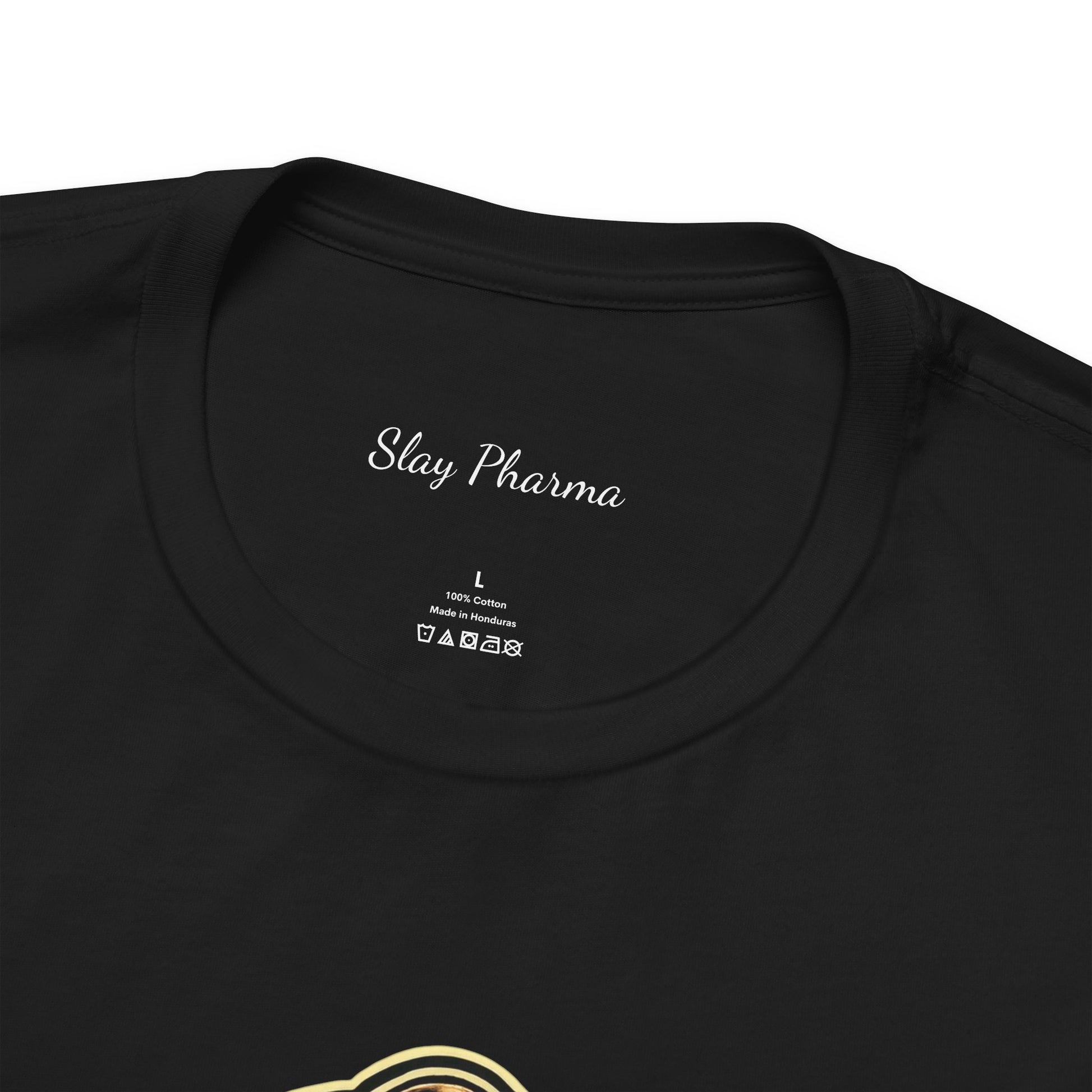 Close-up of black Real Eyes Realize Real Lies t-shirt collar with Slay Pharma neck label and partial front graphic.
