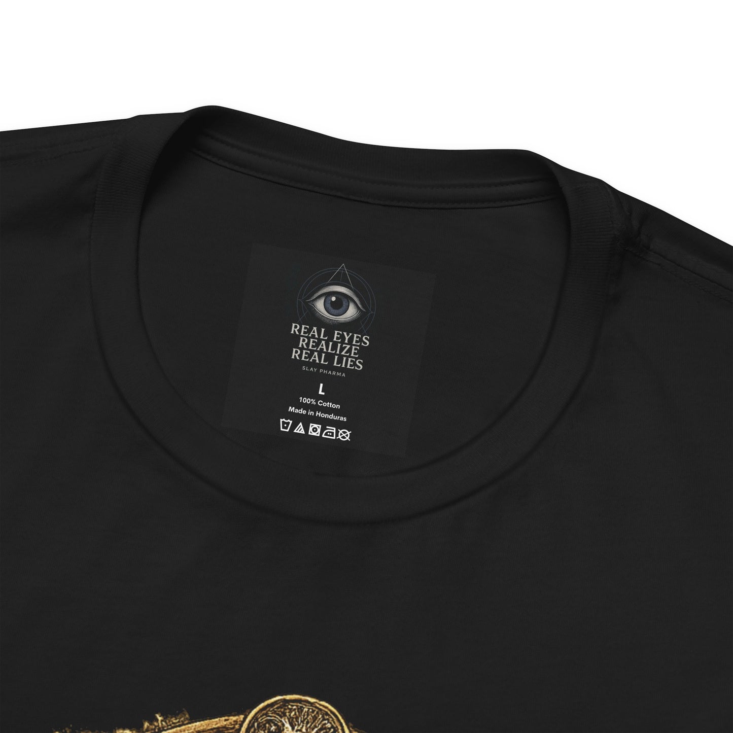 Close-up of black You Can’t Patent God’s Garden t-shirt collar and neck label with partial botanical artwork visible.